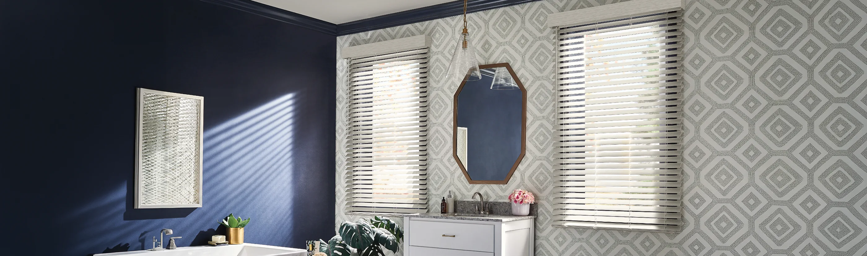 white faux wood blinds in two large windows of a modern decorated bathroom
