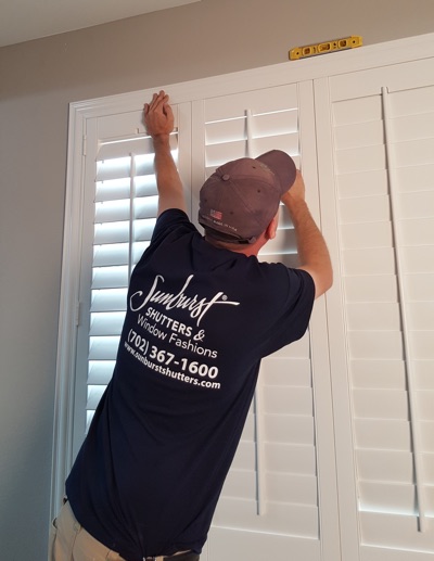 Shutter installation in Denver bedroom.