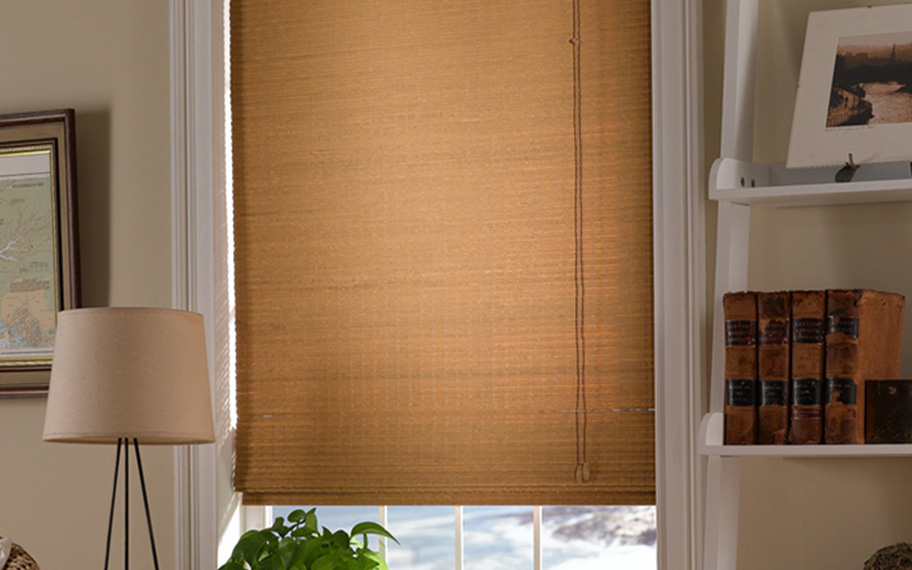 Add a touch of nature to your decor with woven fiber shades in Denver. Tan woven fiber shades in a living room