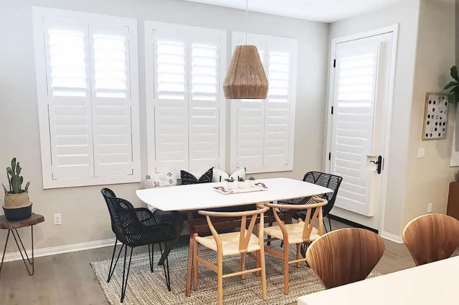 Use Polywood shutters to control natural light levels in your Denver dining room. Polywood shutters with top louvers tilted open in a dining room