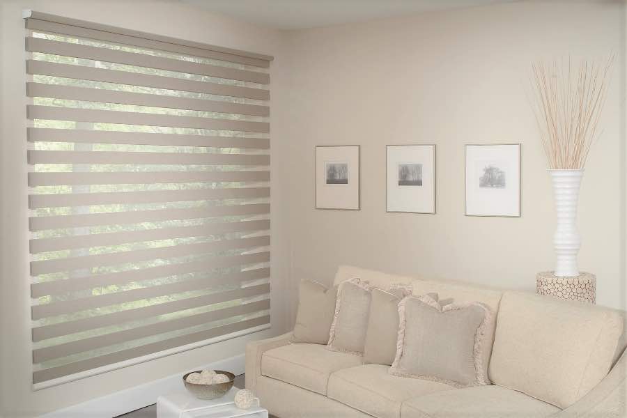 Zebra shades give you a unique combination of light control and style that benefits your Denver home. Zebra shade allows filtered light into a living room