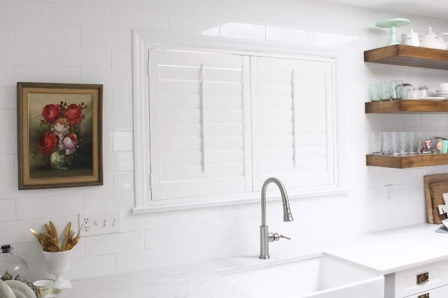 Durable Polywood shutters last for decades, even in kitchens and bathrooms. Polywood shutters over a kitchen sink