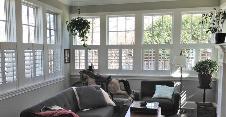 Cafe shutters in a sunroom in Denver. Denver cafe shutters living room