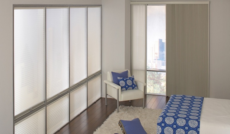 Cellular shades are another option to support a minimalist design. Cellular shades in a minimalistic apartment.