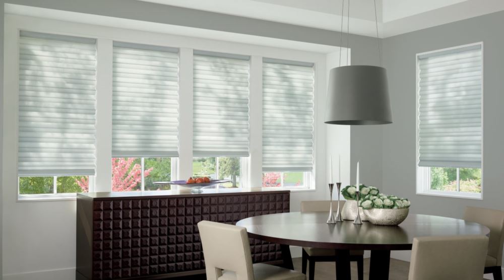 Custom cordless roller shades have a clean look and are appropriate for any room. Cordless motorized shades in a Denver dining room