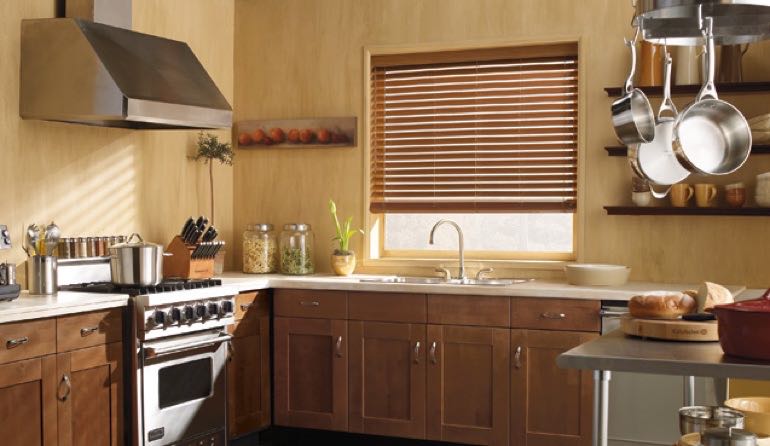 Faux wood blinds look beautiful in Denver kitchens. Denver kitchen faux wood blinds.