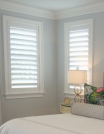 Hidden tilt rod shutters open. White plantation shutters with hidden tilt rods in Denver