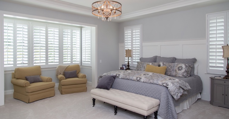 interior shutters offer subtle beauty. Interior shutters in Denver bedroom.