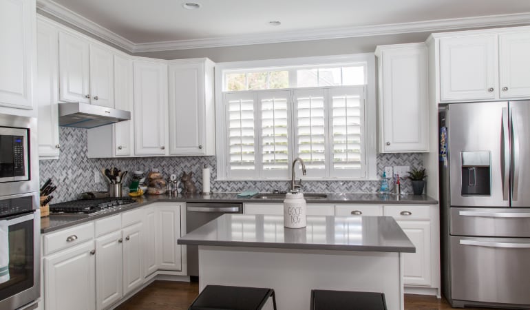 Polywood® plantation shutters resist heat and moisture in your kitchen. Polywood shutters in a Denver gourmet kitchen.