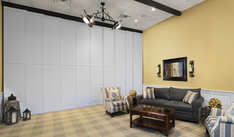 Interior shutteres can be used to divide up a room. Plantation shutters as a room divider for a showroom