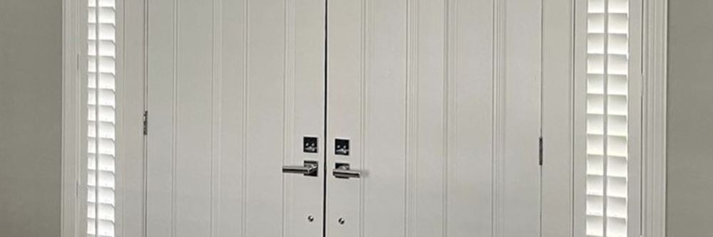 White polywood shutters on sidelights.