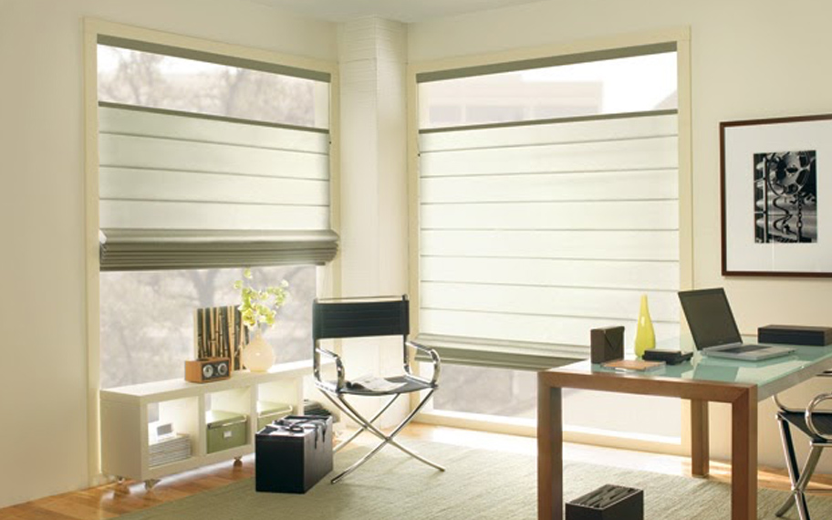 Upgrade your windows with stylish window shades or shutters in Denver. Stylish sheer shades in the corner of a modern office.